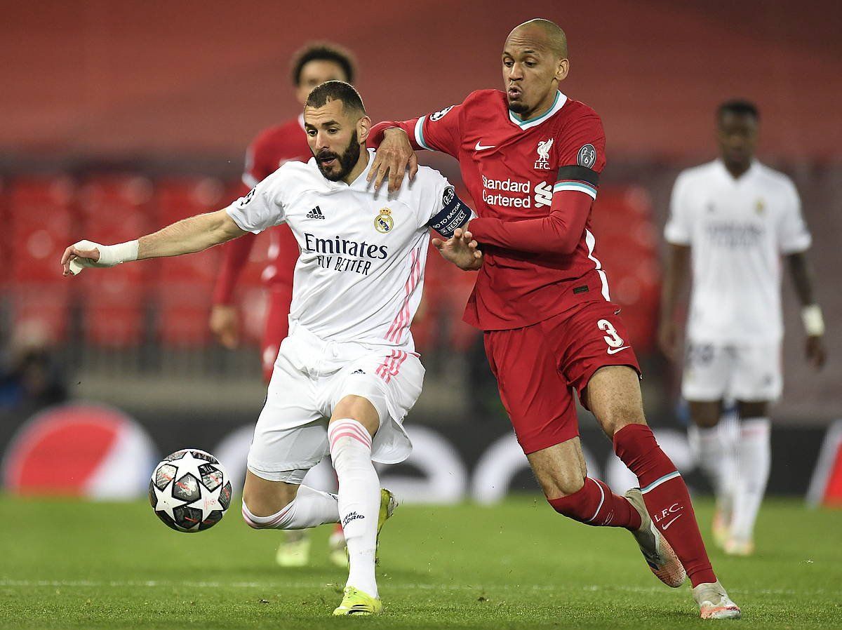 Benzema eta Fabinho, Real Madrilen eta Liverpoolen arteko Txapeldunen Ligako partidan, joan den astean. PETER POWELL / EFE